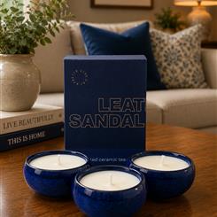 3 candles, 3 different scents in ceramic containers 
